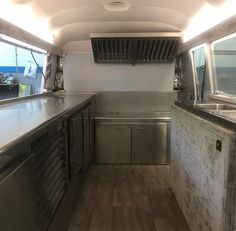 the inside of an rv with stainless steel appliances