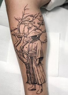 a person with a tree tattoo on their arm