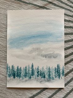 a watercolor painting of trees and clouds in the distance on a striped cloth background