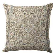 a pillow with an intricate design on the front and back, in cream color scheme