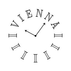 a black and white clock with roman numerals