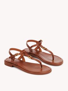 Chloé Marcie Flat Sandal | Chloé US Elegant Slingback Sandals With Buckle For Vacation, Elegant Leather T-strap Sandals For Vacation, Elegant Slingback Sandals With Leather Footbed For Beach, Elegant Beach Slingback Sandals With Leather Footbed, Elegant T-strap Sandals With Buckle Closure For Vacation, Chic Flat T-strap Sandals With Buckle Closure, Elegant Sandals With Leather Lining For Vacation, Elegant T-strap Sandals With Leather Footbed For Summer, Elegant Flat Sandals With Adjustable Strap