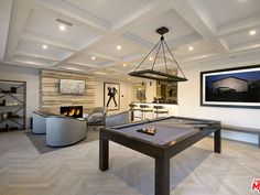 a pool table in the middle of a living room