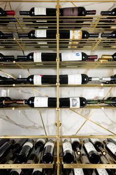 a wine rack filled with lots of bottles