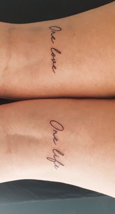 two women with matching tattoos on their arms that say one and only, in cursive writing