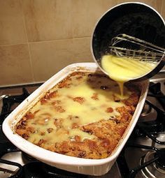 a casserole is being poured into the oven