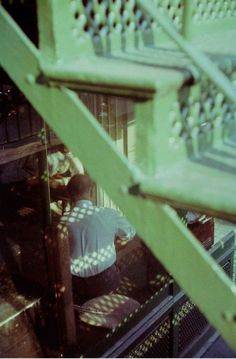 the view from above looking down at people working in an industrial area with metal structures