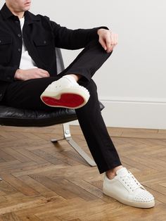 Christian Louboutin's 'Louis Junior' sneakers are a core style in its lineup, with different variations issued each season. This white full-grain leather pair is as classic as it gets, with tonal spiked toecaps delivering a bit of the brand's signature rock 'n' roll energy. Louboutin Outfit Men, Christian Louboutin Outfits Men, Louboutin Shoes Outfit, Louboutin Boots Men, Christian Louboutin Mens Sneakers Outfit, Christian Louboutin Mens Wedding Shoes, Christian Louboutin Shoes Mens, Mens Christian Louboutin Shoes, Louboutin Shoes Mens