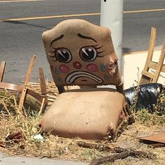 an old chair that is sitting on the ground