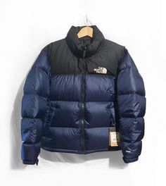 The North Face Men's 1996 Retro Nuptse Jacket Summit Navy / Black Size M New with tags Built for mountain- and city-life, this retro Nuptse jacket that has a boxy silhouette, original shiny ripstop fabric, iconic oversize baffles and stowable hood will keep you warm and dry when it gets cold and wet. FEATURES Classic, down insulated jacket with high-loft baffles and a boxy silhouette Standard fit Inspired by the iconic design lines of our 1996 Nuptse Jacket Original shiny ripstop fabric with DWR finish Oversize baffles Stowable hood packs into collar Stows in hand pocket Internal, secure-zip pocket Exposed, VISLON®, two-way center front zip Adjustable Velcro® cuff tabs Bungee cinch at hem Embroidered, oversize logo on left chest and back-right shoulder  Please leave me your contact phone n The North Face Blue Jacket, Northface Jacket Outfit, 1996 Nuptse Jacket, 1996 Retro Nuptse Jacket, Fit Inspired, North Face 700, Retro Nuptse Jacket, Nuptse Jacket, North Face Nuptse