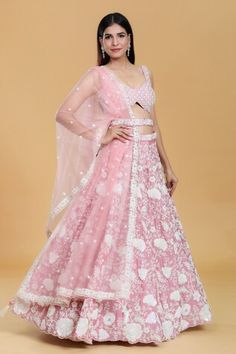 Rose gold attached cancan lehenga with all over floral embroidery using sequins, zari, stone work. Paired with an embroidered blouse and dupatta. Comes along with embroidered belt. - Aza Fashions Pink Net Sharara For Designer Wear, Festive Net Lehenga With Floral Embroidery, Pink Net Traditional Wear For Reception, Pink Net Dresses For Designer Wear, Festive Floral Embroidery Lehenga In Net, Fitted Pink Net Traditional Wear, Pink Net Sets For Diwali, Pink Net Festive Dress, Festive Pink Net Sets