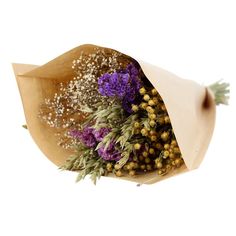 a bouquet of flowers wrapped in brown paper