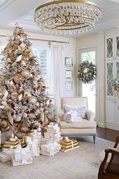 a decorated christmas tree in the middle of a living room with presents on the floor