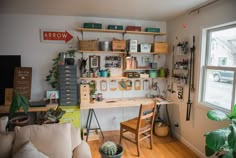 a living room filled with furniture and lots of shelves