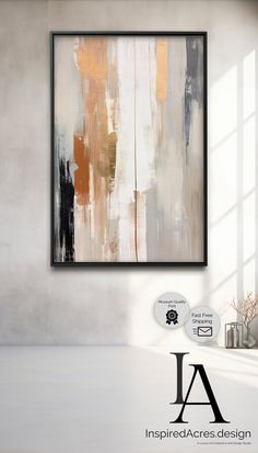 an abstract painting hanging on the wall in a room with white walls and flooring