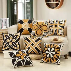 pillows are on display in front of a couch with the words ebay written below it