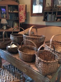 wicker baskets sitting on top of a wooden table