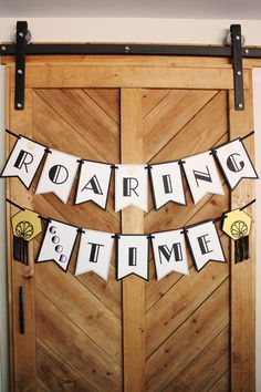 a wooden door decorated with white and black decorations