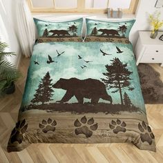 a bed with a bear and birds on it