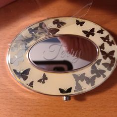 there is a mirror with butterflies on it