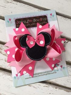 a pink and black minnie mouse hair bow