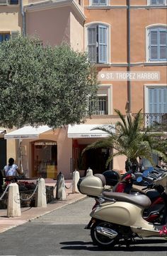 several motorcycles parked in front of a building