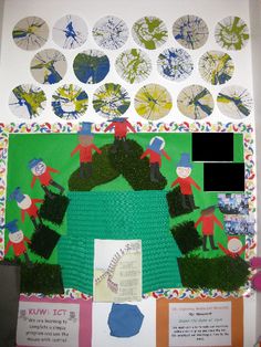 a bulletin board with paper plates and pictures on it that include children's artwork