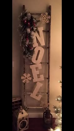 an old ladder decorated with snowflakes and christmas decorations