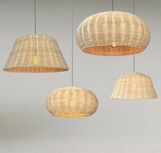 three hanging lights made out of wicker