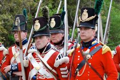 a group of men in uniform standing next to each other