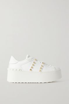 Valentino Garavani's sneakers debuted in the brand's 'Rockstud Untitled' collection in collaboration with artist Vanessa Beecroft. This pair is made from white leather and grounded on sturdy platform rubber soles. The label's signature pyramid studs trace the sides and heel. Vanessa Beecroft, Valentino Shoes Sneakers, Valentino Garavani Sneakers, Valentino Sneakers, Studded Sneakers, Valentino Garavani Shoes, Valentino Rockstud, Valentino Shoes, Brown Sneakers