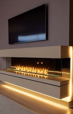 a modern fireplace in a living room next to a flat screen tv on the wall