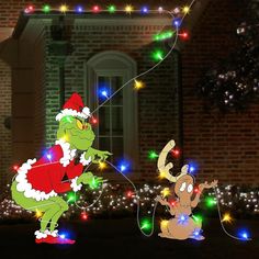 an animated christmas scene with santa clause and reindeer in front of a house decorated for the holiday season