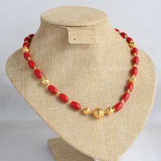 Crafted with coral-colored beads and gold-plated beads, this necklace boasts a handmade design, embodying a contemporary ethnic aesthetic. Vibrant and elegant, it radiates sophistication, seamlessly blending tradition and modern flair. Feel free to explore other options featuring coral and beads. As our exclusive design, we welcome customization requests--message us to make this piece uniquely yours. Length - 18 inch Beads Collection Gold, Coral Beads Necklace Indian Gold, Coral Gold Necklace, Coral Chain Designs, Elegant Red Coral Necklace With Gold Beads, Red Coral Necklace With Gold Round Beads, Elegant Red Coral Beaded Necklace With Gold Beads, Red Coral Jewelry With Gold Beads, Red Coral Necklace With Gold Beads For Gift