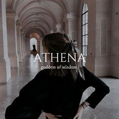 the back of a woman's head in an empty hallway with text athena goddess of wisdom