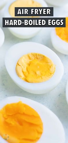 an image of hard boiled eggs in white plates with text overlay that reads air fryer hard - boiled eggs