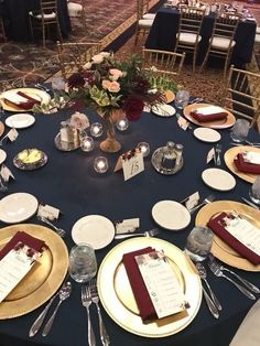 the table is set up with place settings for dinner and reception guests to sit at