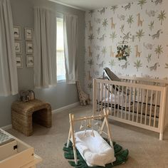 a baby's room with a crib in the middle