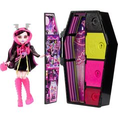 a doll in a pink and black outfit next to a box