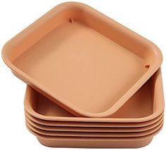 stack of brown baking pans on top of each other