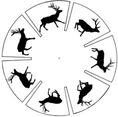 a circle with silhouettes of deer and antelope on it, in black and white