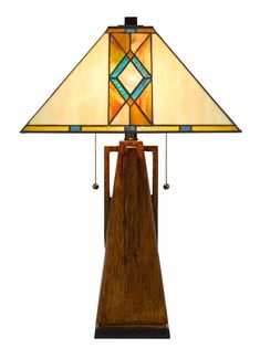 a table lamp with a wooden base and stained glass shade on the top of it