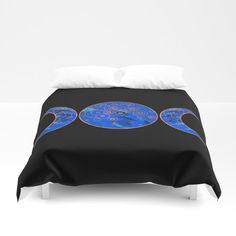 a black comforter with blue and gold designs on it