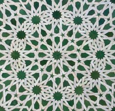 green and white geometric pattern on the wall