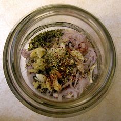 a glass jar filled with food on top of a table