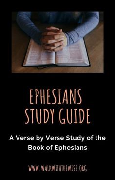 the book ephesians study guide with hands folded on top of an open bible