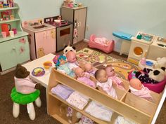 there are many toys in the playroom with baby's and toddler's