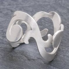 Thai designer Jantana creates the illusion of frothy rolling waves for this original band ring. It is crafted by hand with flirty openwork featuring Jantana's trademark brushed sating finish. .925 Sterling silver Contemporary Jewelry Design, Tiny Rings, Swirl Ring, Sterling Silver Rings Bands, Sterling Silver Dangle Earrings, Unique Jewelry Designs, Pretty Rings, Silver Band Ring, Contemporary Jewelry