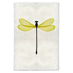 a yellow dragonfly sitting on top of a piece of paper