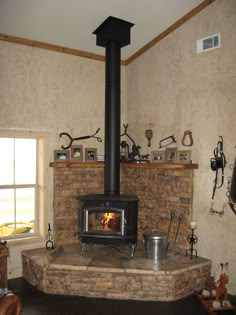 a wood burning stove sitting inside of a living room